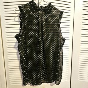 Sleeveless sheer top with ruffle accents